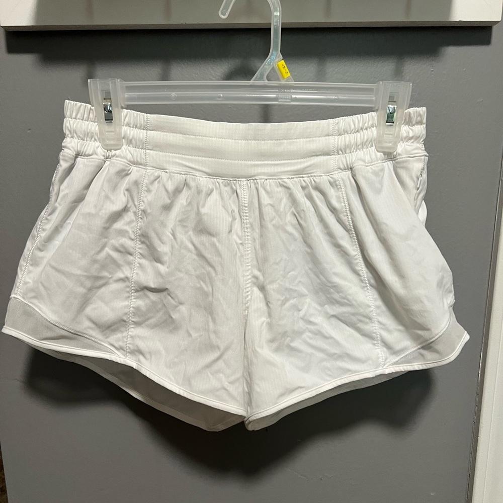 White Lululemon shorts with built in material. Worn once.